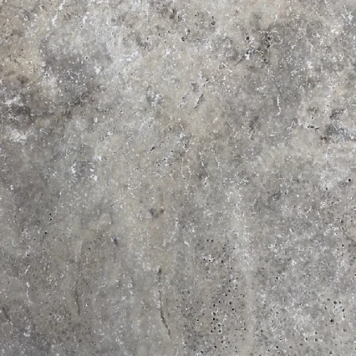 Trawertyn bębnowany szary Silver Ash – widoczne naturalne kawerny i pory